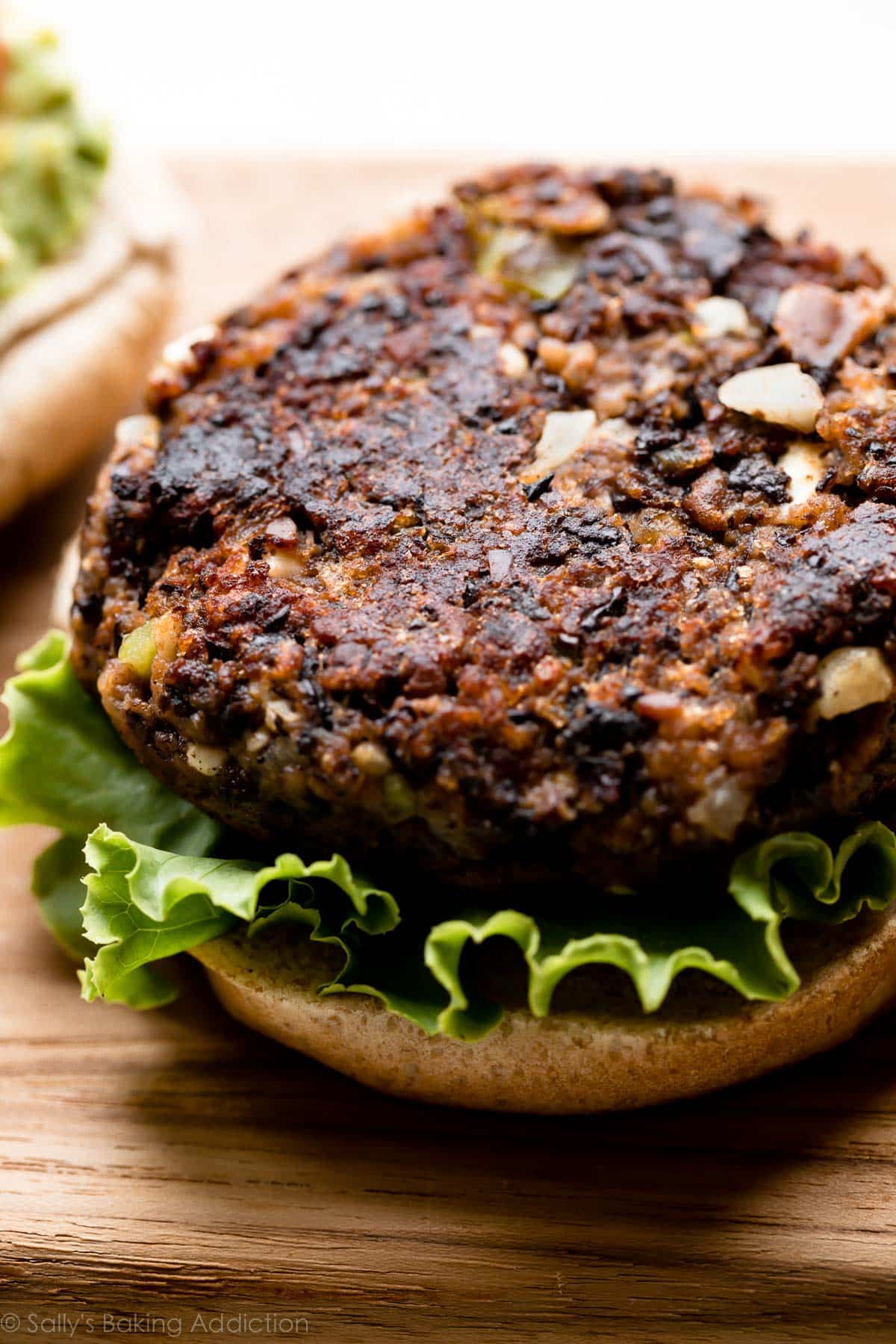 black bean burger on a bun with lettuce without the top bun