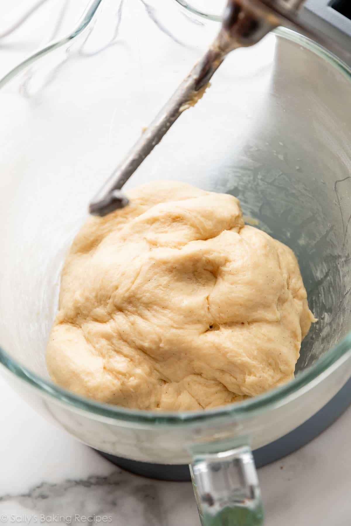 dough in glass bowl of stand mixer.