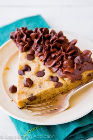 slice of chocolate chip cookie cake on a white plate