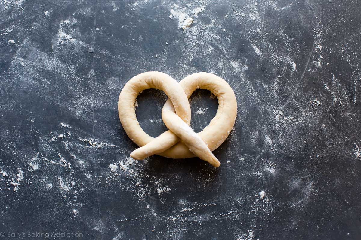 soft pretzel dough shaped into a pretzel