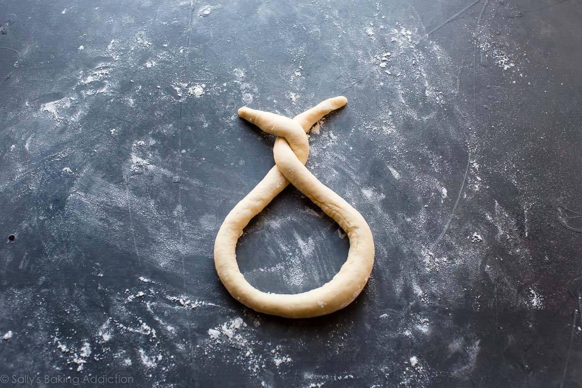 soft pretzel dough twisted to form a pretzel